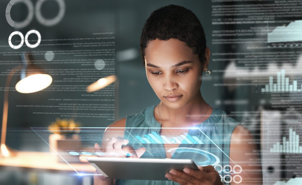 Profissional analisa painel digital com gráficos e dados — como maximizar recursos para inovação com a Embrapii e impulsionar P&D nas empresas