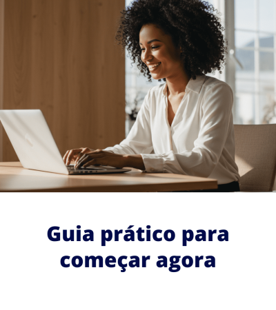 Profissional trabalha em notebook em escritório iluminado, representando o guia prático para começar agora